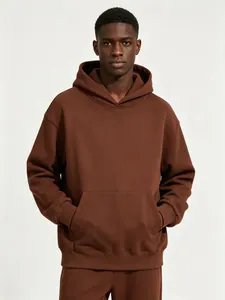 Detail view of a men's heavy brown oversized pullover hoodie with a spacious front pocket