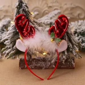 Festive Christmas headband detail with red glittery reindeer antlers and white faux fur