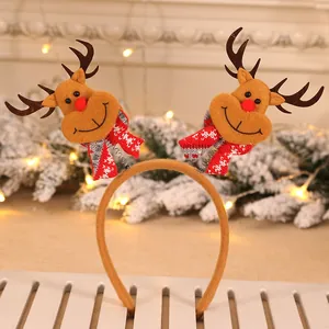 Cute Christmas headband featuring two plush reindeer ornaments with spring-mounted design