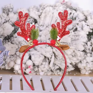 Festive red glitter reindeer antler headband with pine needles and bells for Christmas
