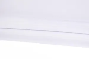 Detailed close-up of white breathable moisture-wicking athletic fabric stitching