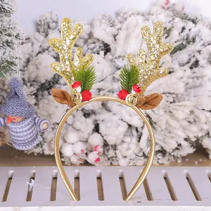 Festive gold glitter reindeer antler headband with Christmas decorations