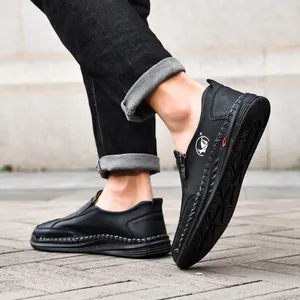 Comfortable men's black casual leather loafers with hand-stitched details and side zipper