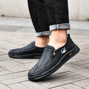 Black casual leather shoes for men with hand-stitched detailing and side zipper closure