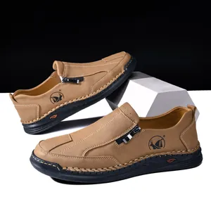 Close-up of men's tan casual leather loafers with hand-stitched detailing and side zip.