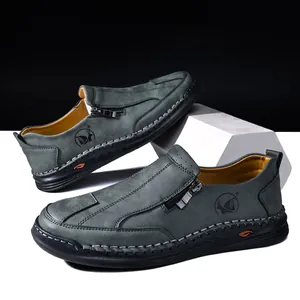 Detail view of men's casual loafers with hand-stitched seams and side zipper
