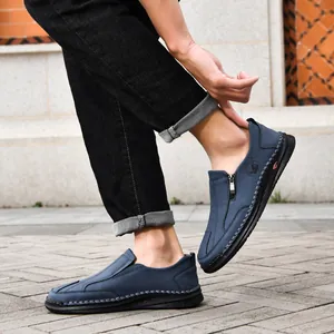 Men's blue casual leather slip-ons with hand-stitched details and side zipper