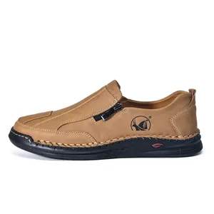 Side view of brown men's casual leather shoes with zipper detail and hand-stitching