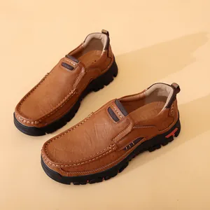 Close-up of brown leather men's loafers with thick rubber soles and hand-stitched detail
