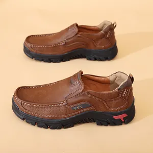Detail view of brown leather casual loafers with soft outdoor sole and stitching.