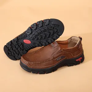 Detail view of brown men's leather loafers featuring a durable non-slip rubber outer sole