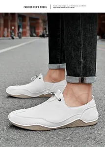 Detail of white men's leather loafers with unique non-slip sole in a street setting