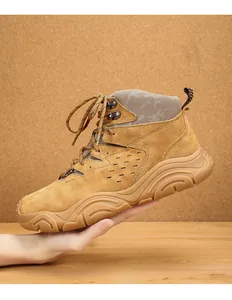Side view of a durable tan suede winter snow boot with thick non-slip soles