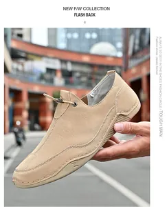 Close-up detail of khaki suede casual outdoor men's loafers featuring elastic toggle.