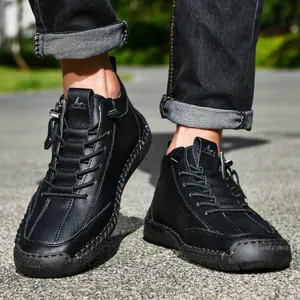 Detailed view of men's black leather Martin boots featuring a side zipper and hand-stitched sole