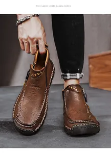 Detailansicht der braunen Herren-Martin-Stiefel aus Leder mit handgefertigten Nähten
