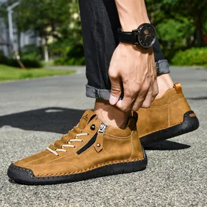 Close-up detail of brown men's British style Martin boots featuring a side zipper