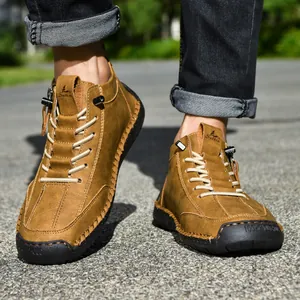 Stylish men's brown leather Martin boots featuring casual mid-top design and side zipper detail