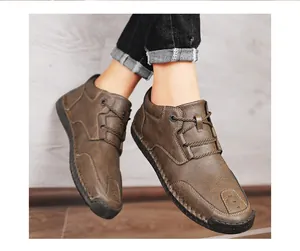 Close-up of men's brown leather casual boots with hand-stitched detailing.