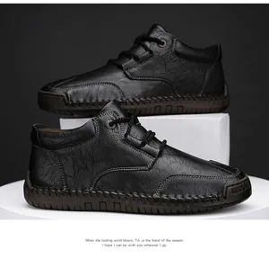 Men's premium black textured leather Martin boots featuring decorative hand-stitching detail