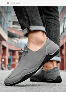 Close-up of men's gray casual shoes with octopus sole design shown on a model's feet
