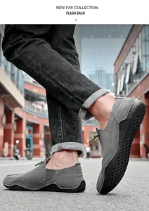 Detailed side view of men's gray suede casual shoes featuring durable rubber outsole
