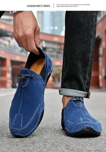 Detail shot of men's blue suede outdoor leisure slip-on shoes on city street background.