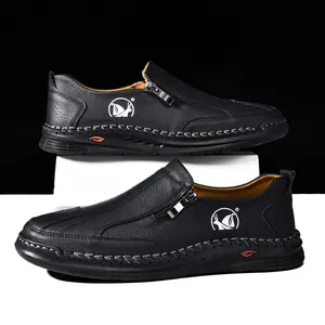 Men's black casual leather loafers with side zipper and hand-stitched sole detail