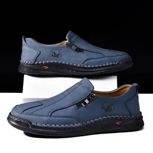 Men's casual blue leather slip-on shoes with hand-stitched details and side zipper.