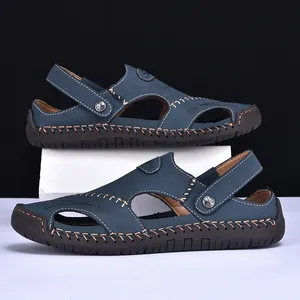 Detailed side view of blue hand-stitched men's casual sandals with breathable cutouts