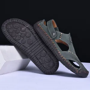 Macro view of men's hand-stitched leather sandals featuring a durable non-slip rubber sole