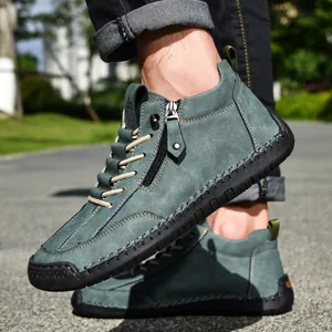 Men's stylish teal suede casual boots featuring side zipper and hand-stitched details.