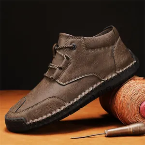 Men's brown textured leather casual boots with hand-stitched detailing on a rustic base