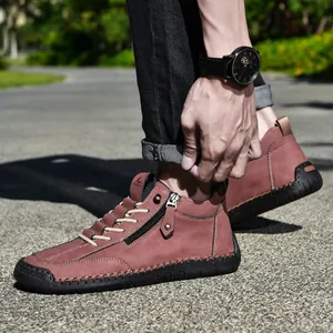Close-up of men's casual terracotta leather short boots with side zipper detail