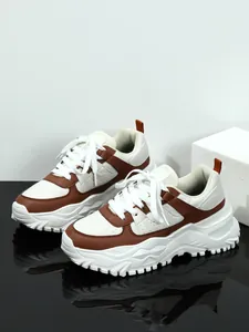 Brown and white chunky sneakers with a breathable mesh upper and durable thick sole