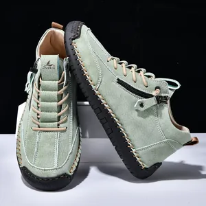 Detail view of men's sage green Martin boots with side zipper and rugged lug sole