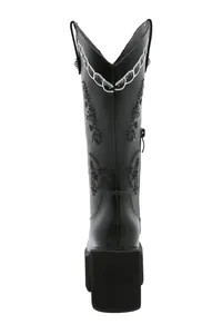 Detailed back view of black platform western boots with intricate floral embroidery.