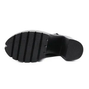 Detail view of the thick black platform sole with deep anti-slip ridges
