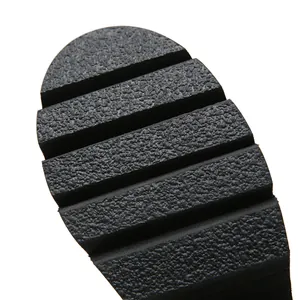 Detailed macro view showing the textured non-slip lugged sole of the platform boots