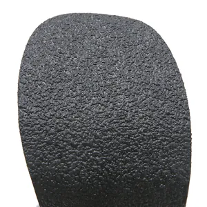 Detailed macro view showing the coarse anti-slip texture of the black platform boot sole