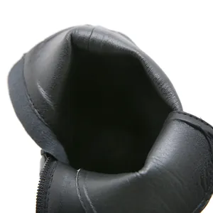 Detail of black high-heel Martin boot showing smooth inner lining and side zipper