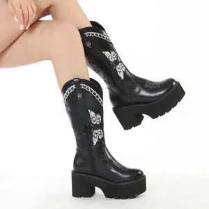 Retro black faux leather platform high boots featuring white butterfly embroidery.