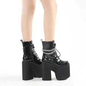 Ultra high black patent leather platform boots with chunky heels and silver chains