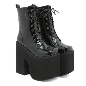 Super high platform boots with block heels and patent finish for stage performance
