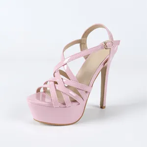 Elegant pink patent leather platform high heels with cross-strap design for parties.
