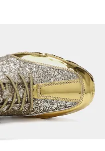 Close-up macro detail showing gold glitter texture and metallic finish on fashion boots