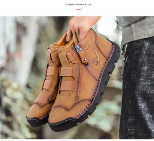 Detailed view of hand-stitched brown leather high-top men's casual shoes with side zipper