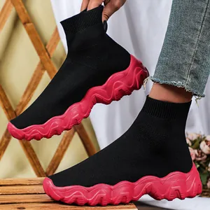 Fashionable women's black mid-top fly-knit sock sneakers with a chunky red wave sole