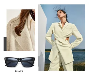 Modische schwarze Cat-Eye-Sonnenbrille mit Reisnagel-Akzenten im Street-Style