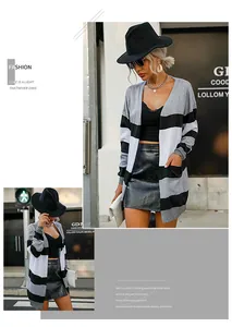 Close-up of women's long sleeve striped knit cardigan styled with a leather skirt